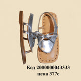 Серебряные босоножки с бантом